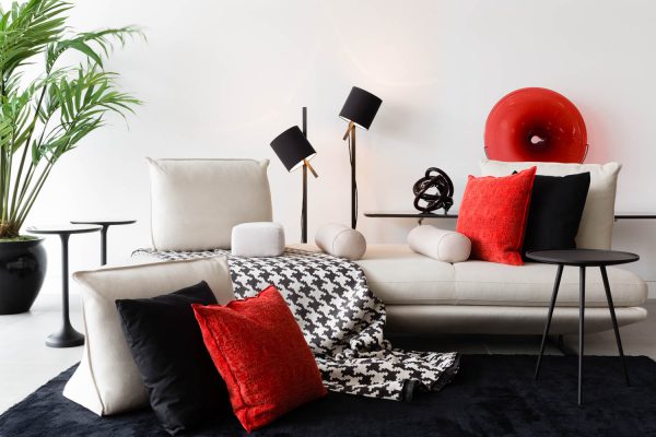 An interior product photograph styled first with red and then black props